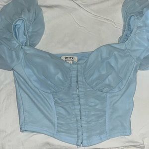 This is a sky blue corset top from Privy, in a size small.